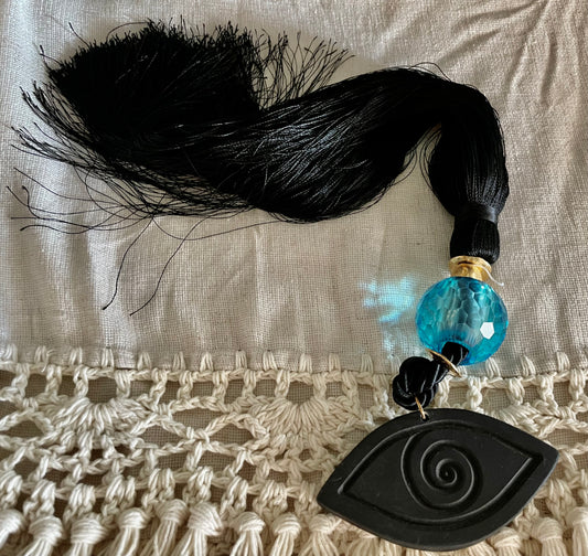 Lucky Charm with Black Ceramic Eye, Blue Crystal and Black Silk Tassel