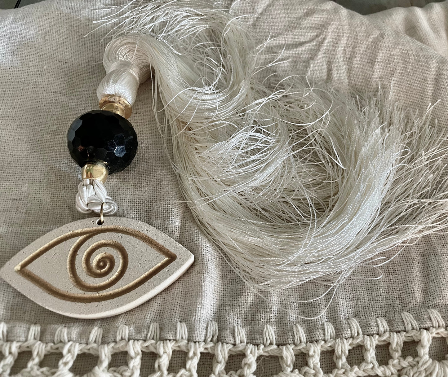 Lucky Charm with White & Gold Ceramic Eye, Crystal and White Silk Tassel